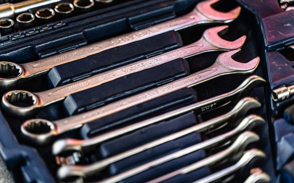 A close-up of a mechanic's wrench set