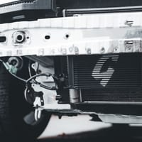 Close-up of a car radiator and front bumper