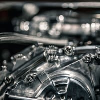 Close-up of engine hardware and mounting bolts