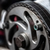 Close-up of an engine timing belt and camshaft sprocket