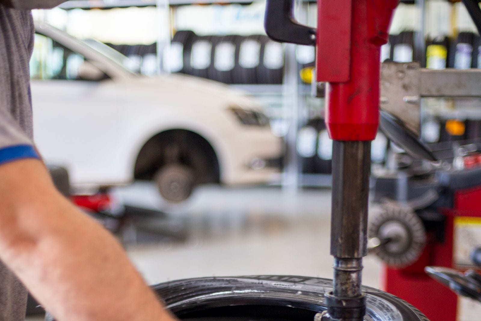 A tire being fitted on a tire-changing machine