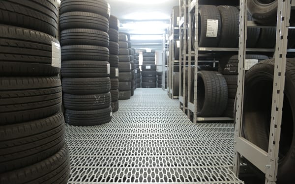 Rows of stacked tires in a storage warehouse